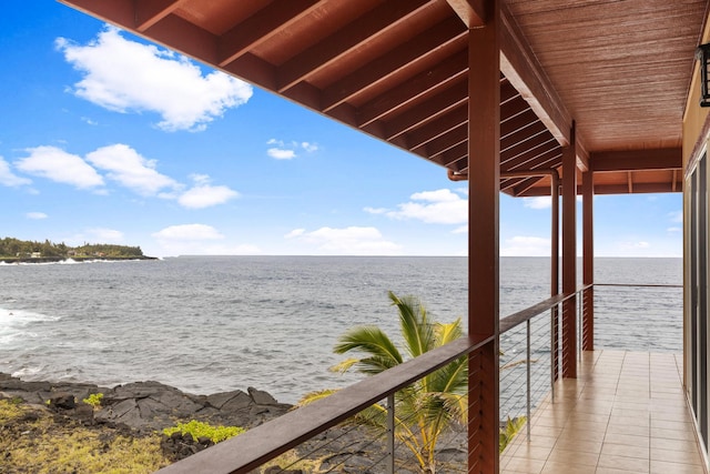 view of dock featuring a water view and a balcony