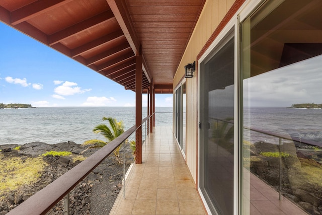 balcony featuring a water view