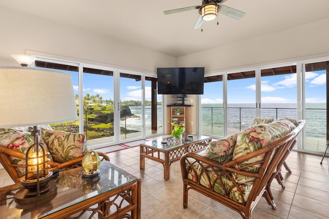 sunroom / solarium with a wealth of natural light and ceiling fan