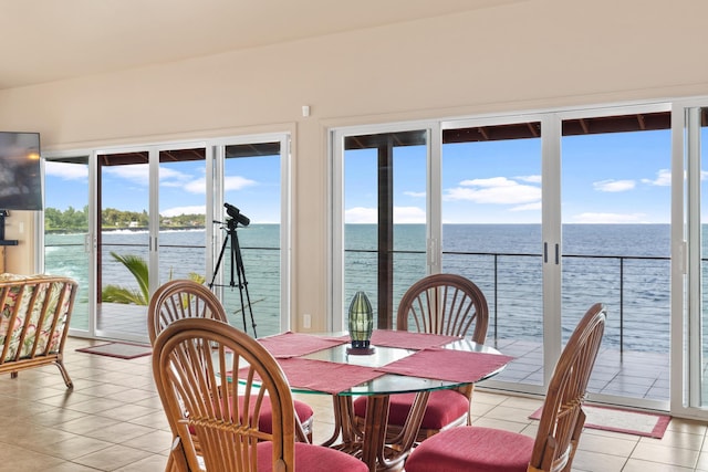 sunroom / solarium with a water view