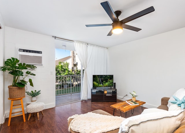 living room featuring a wall mounted AC, ceiling fan, and dark wood-type flooring