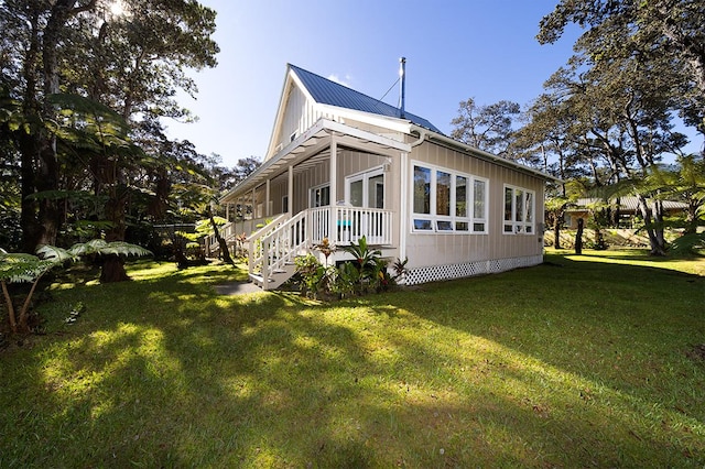 view of property exterior with a lawn