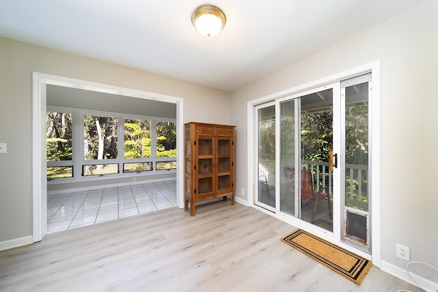 interior space featuring plenty of natural light and light hardwood / wood-style floors