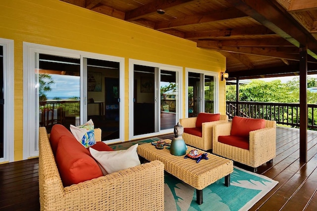 wooden deck with an outdoor living space