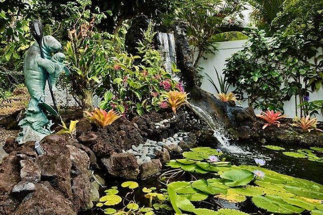 exterior details featuring a small pond