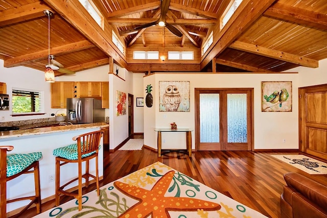 interior space with dark hardwood / wood-style flooring, french doors, wooden ceiling, and beamed ceiling