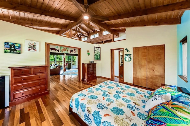 bedroom featuring hardwood / wood-style floors, wooden ceiling, and vaulted ceiling with beams