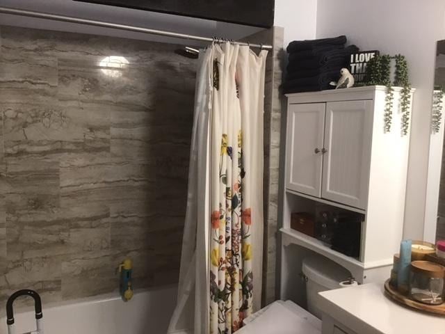 full bathroom with vanity, toilet, and shower / bathtub combination with curtain