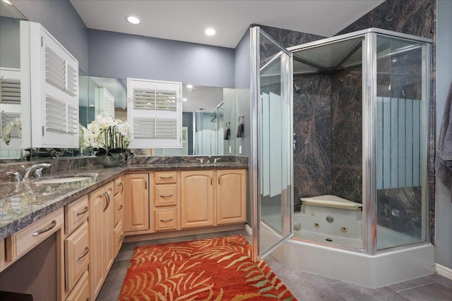 bathroom featuring shower with separate bathtub, vanity, and tile patterned floors