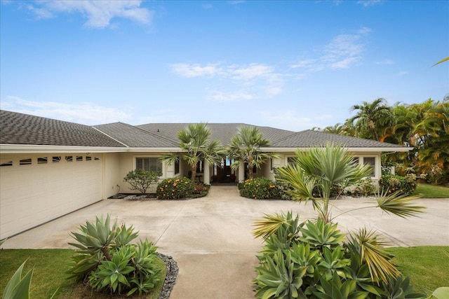 ranch-style house featuring a garage