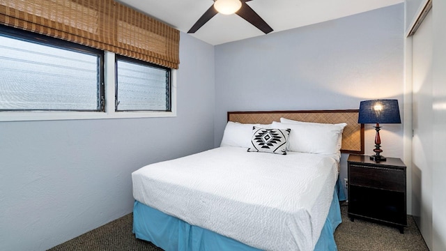 carpeted bedroom featuring ceiling fan