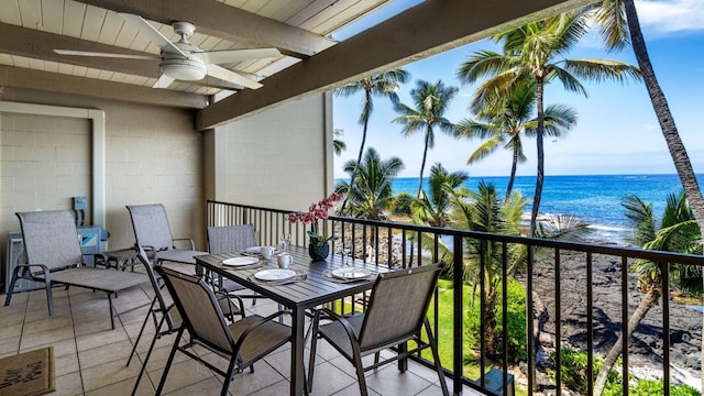 balcony featuring a water view and ceiling fan