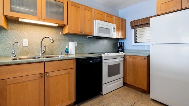 kitchen featuring decorative backsplash, white appliances, light tile patterned flooring, and sink