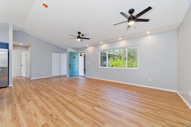 unfurnished living room featuring ceiling fan, light hardwood / wood-style flooring, and lofted ceiling