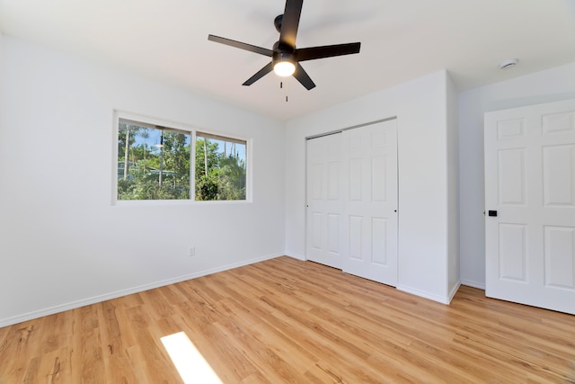 unfurnished bedroom with a closet, ceiling fan, and light hardwood / wood-style flooring