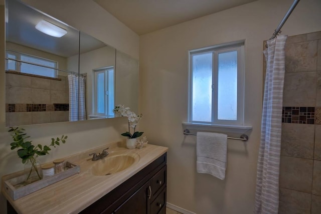 bathroom with a shower with curtain and vanity