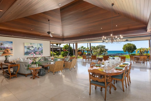 dining space featuring a water view, wood ceiling, and ceiling fan with notable chandelier