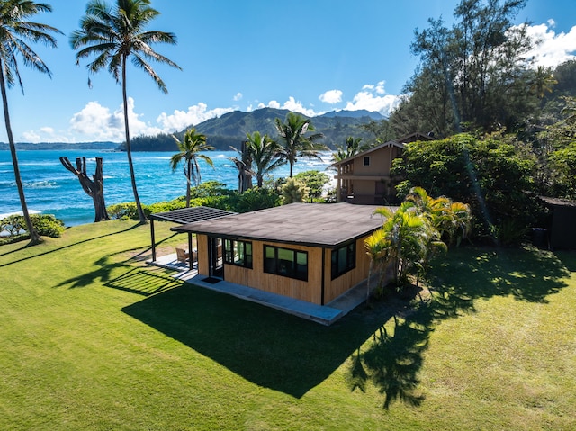 exterior space featuring a water and mountain view