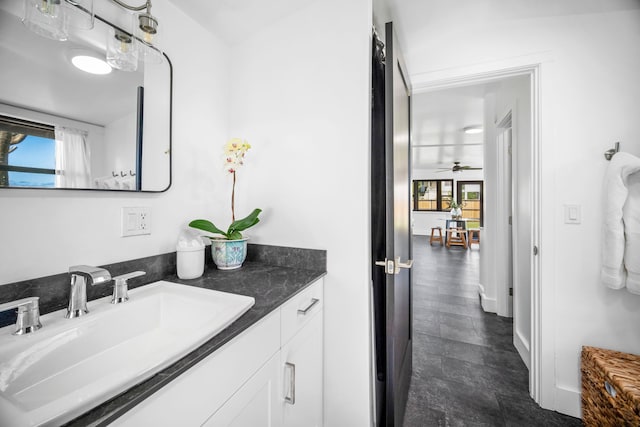 bathroom with vanity, plenty of natural light, and ceiling fan