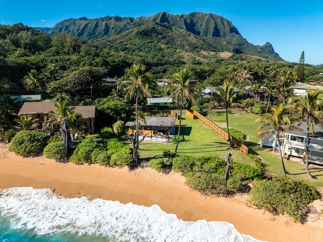 birds eye view of property with a water and mountain view