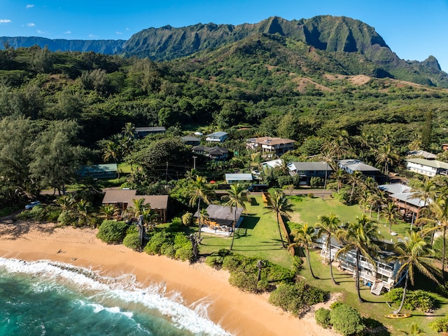 birds eye view of property with a water and mountain view