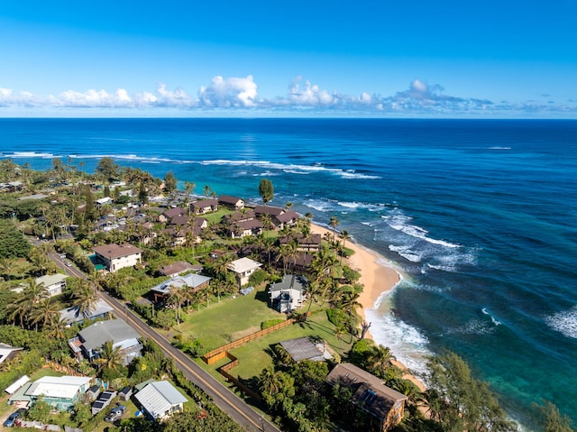 birds eye view of property featuring a view of the beach and a water view