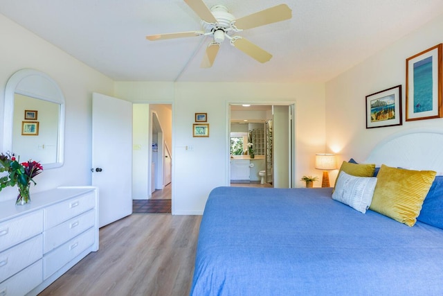 bedroom featuring light wood-type flooring, connected bathroom, and ceiling fan