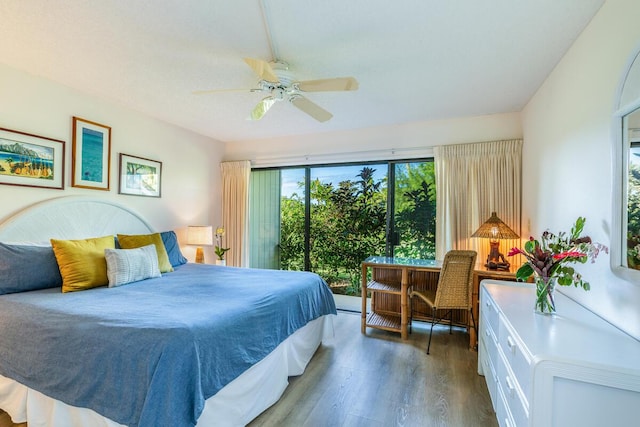 bedroom with ceiling fan and hardwood / wood-style flooring