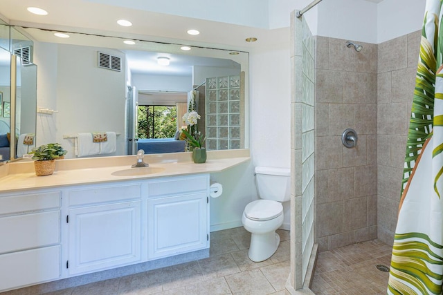 bathroom with a shower with curtain, vanity, and toilet