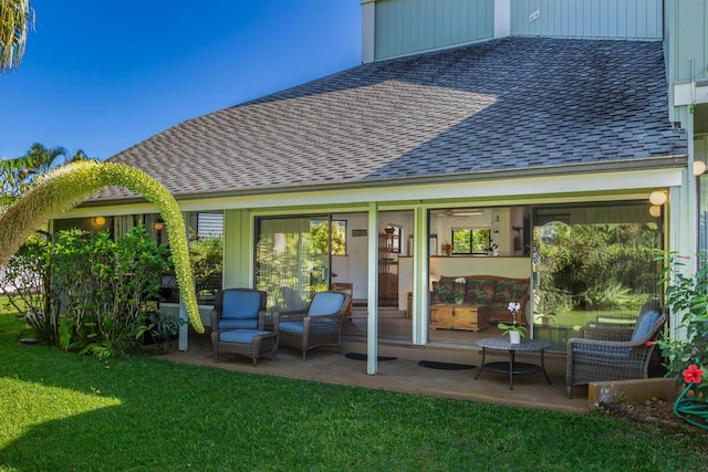 back of property with a patio and a lawn