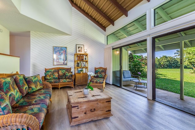 living room featuring wooden ceiling, beamed ceiling, high vaulted ceiling, and wood-type flooring