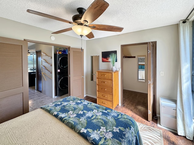 bedroom with hardwood / wood-style floors, a textured ceiling, a closet, and ceiling fan