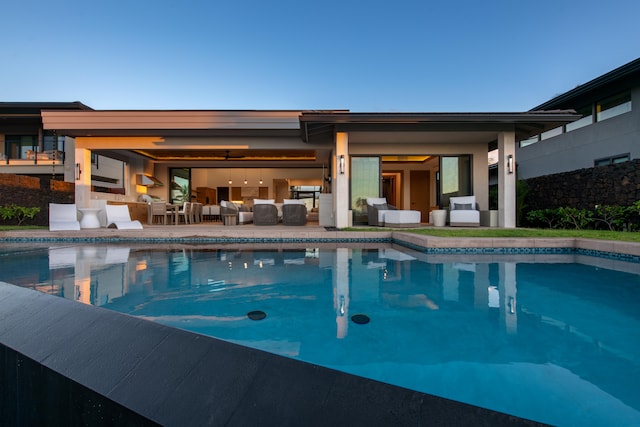 view of pool with an outdoor hangout area and a patio