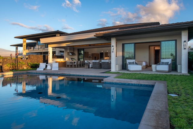 view of swimming pool featuring a patio and an outdoor hangout area