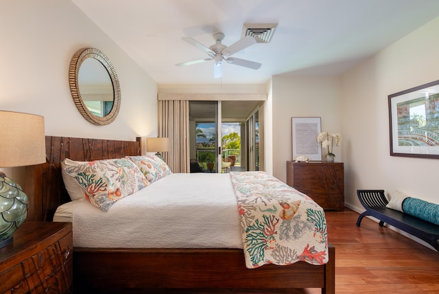 bedroom with access to outside, ceiling fan, and hardwood / wood-style floors