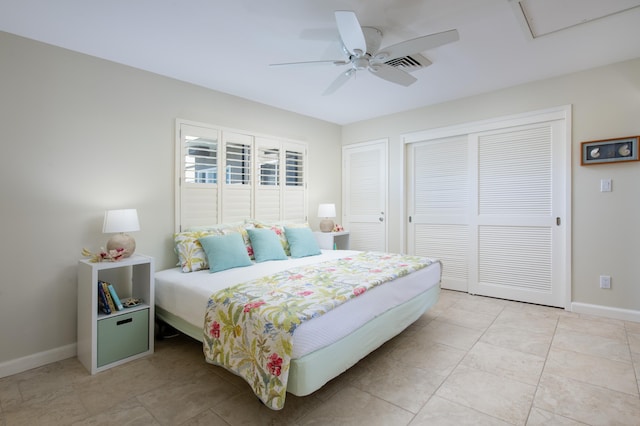 tiled bedroom featuring ceiling fan