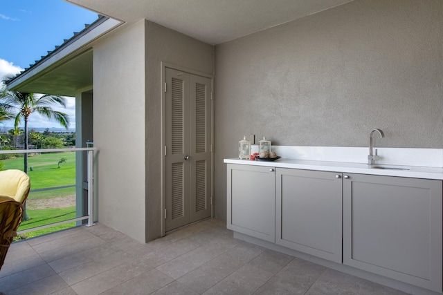 bathroom featuring tile patterned flooring and sink