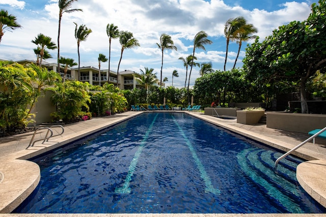 view of swimming pool featuring a patio area