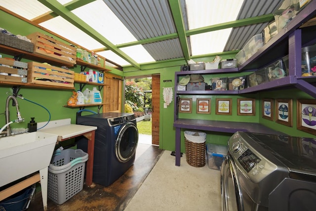 laundry area featuring separate washer and dryer and sink