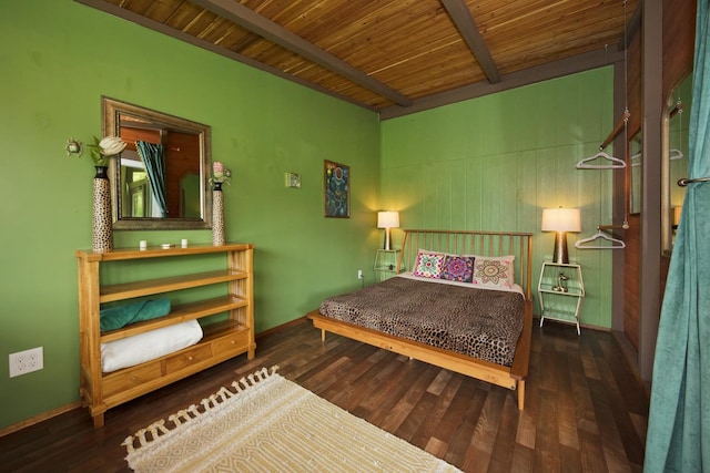 bedroom with beamed ceiling, dark hardwood / wood-style flooring, and wooden ceiling