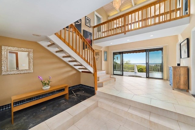 interior space featuring tile patterned flooring and a high ceiling