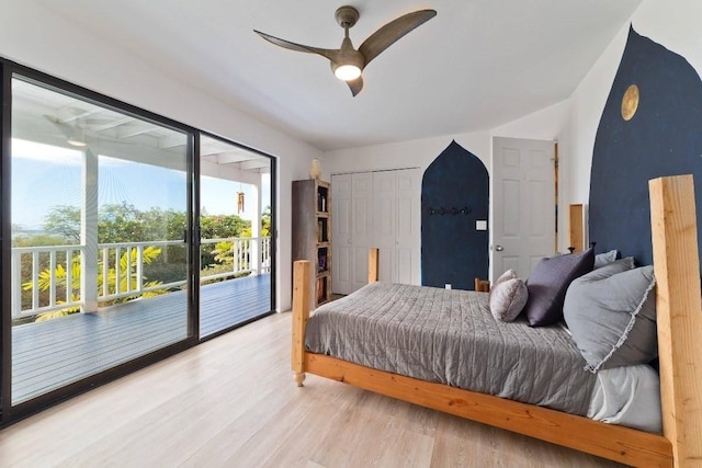 bedroom featuring hardwood / wood-style flooring, ceiling fan, access to exterior, and a closet