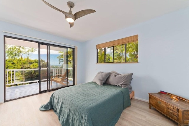 bedroom featuring access to outside, ceiling fan, and light wood-type flooring