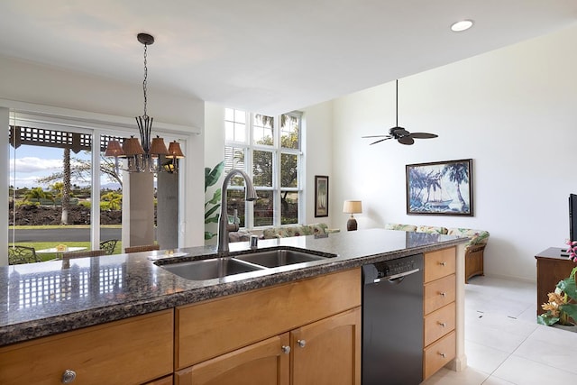 kitchen featuring ceiling fan with notable chandelier, sink, light tile patterned floors, black dishwasher, and decorative light fixtures