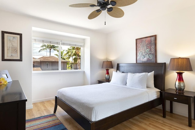 bedroom with light wood-type flooring and ceiling fan