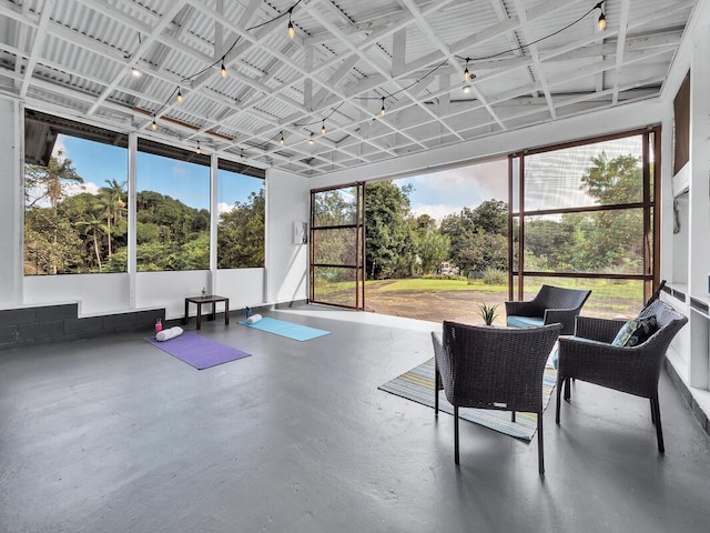 sunroom / solarium featuring a healthy amount of sunlight