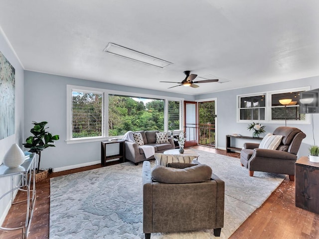 living room with ceiling fan, a healthy amount of sunlight, and hardwood / wood-style floors