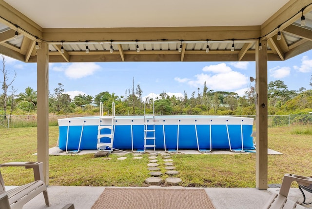 exterior space featuring a patio and a fenced in pool