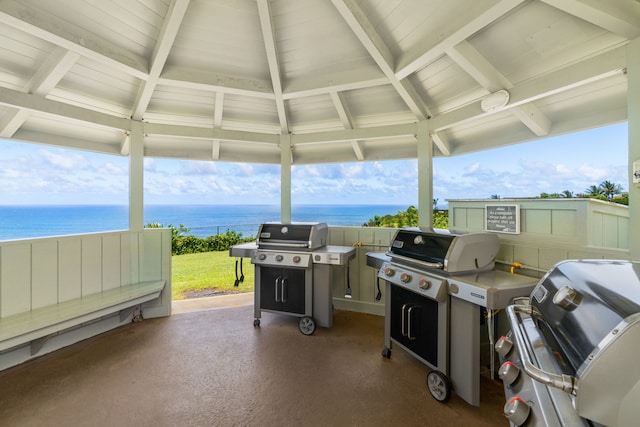 view of patio / terrace with a gazebo, a water view, and grilling area