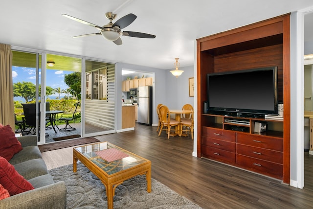 living room with dark hardwood / wood-style floors and ceiling fan